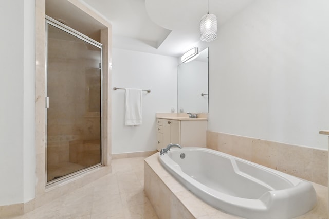 bathroom featuring tile flooring, shower with separate bathtub, and large vanity