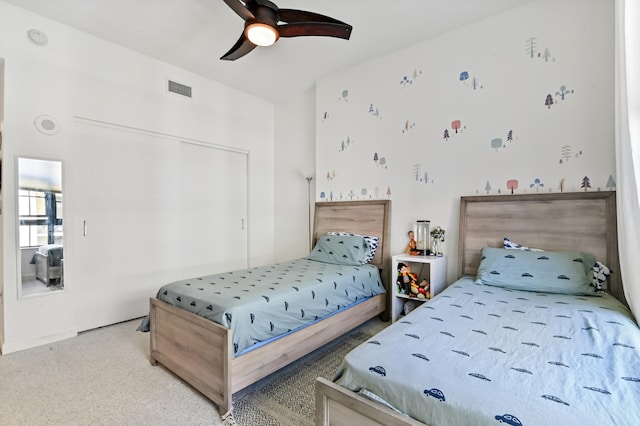 carpeted bedroom with ceiling fan