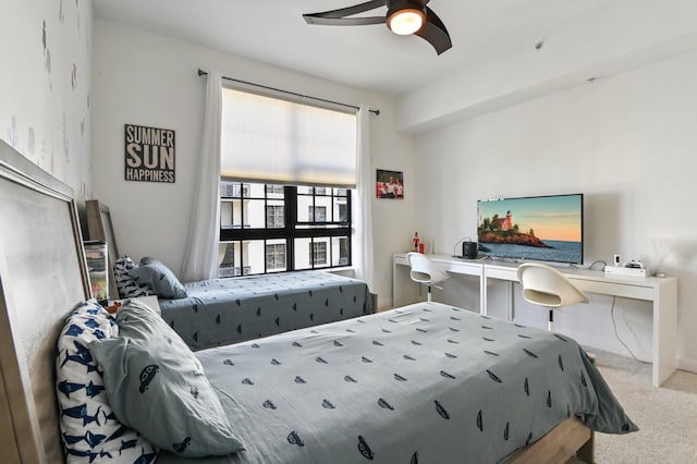 carpeted bedroom featuring ceiling fan