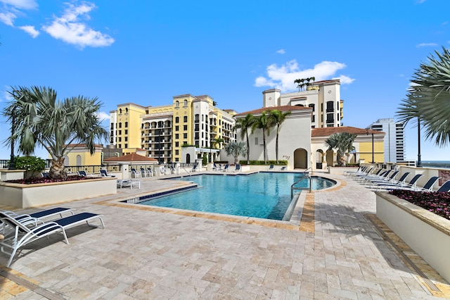 view of swimming pool with a patio