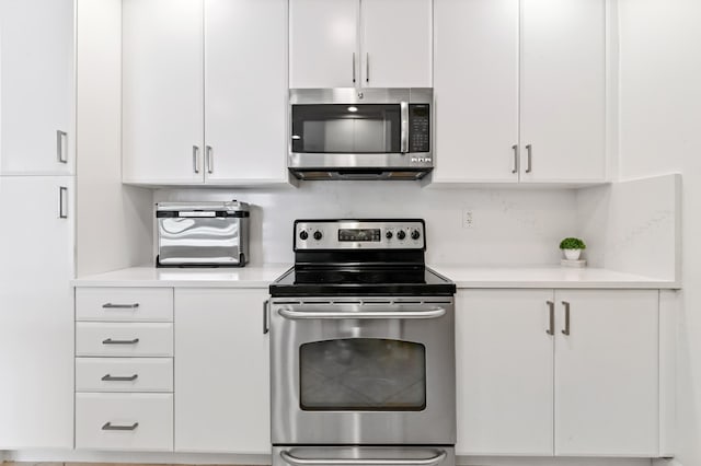 kitchen featuring white cabinets and stainless steel appliances