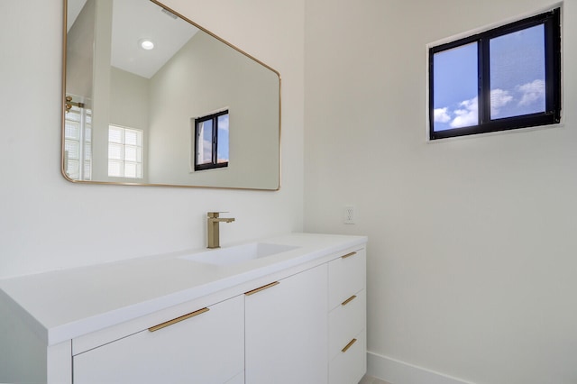 bathroom with vanity with extensive cabinet space