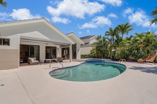 view of swimming pool featuring a patio area