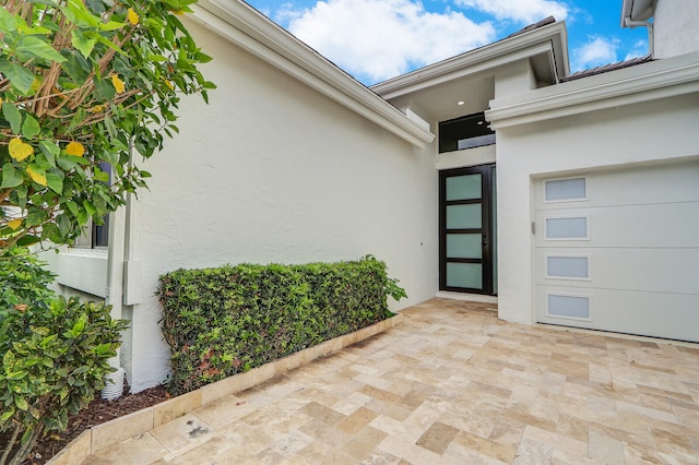 property entrance featuring a patio area