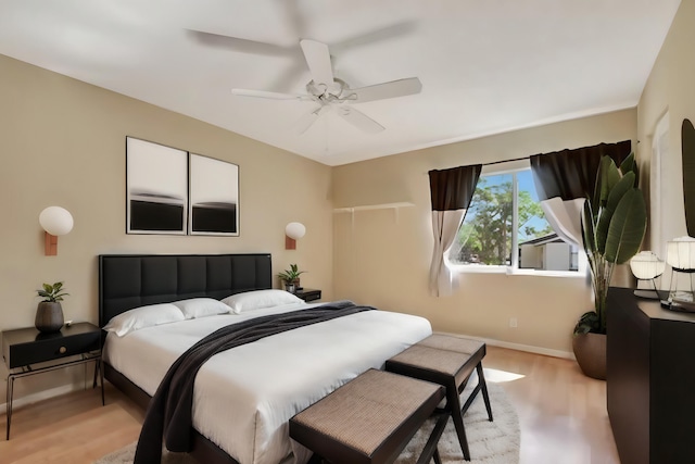 bedroom featuring ceiling fan and light hardwood / wood-style floors