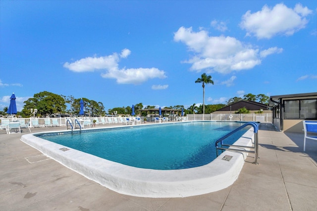 view of swimming pool featuring a patio area