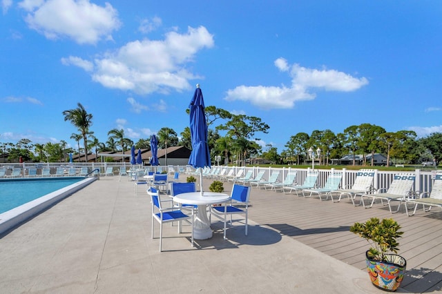 view of swimming pool featuring a patio area