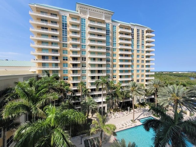 view of building exterior with a community pool