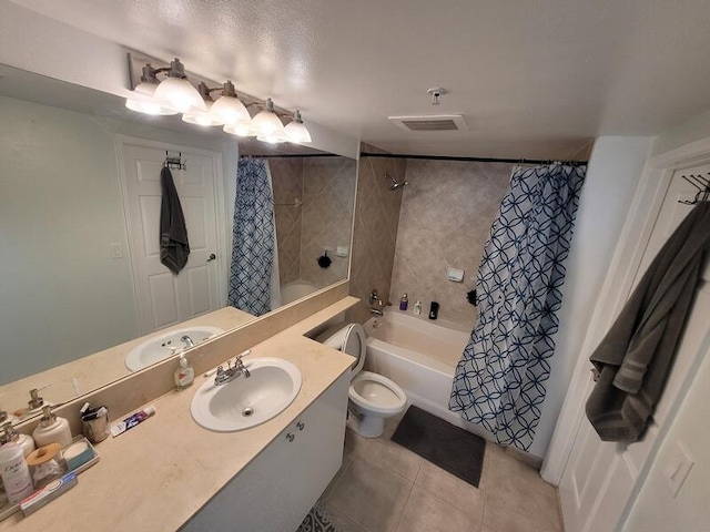 full bathroom with tile flooring, toilet, vanity, and shower / tub combo