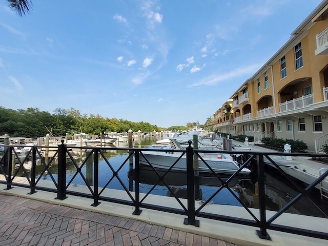 exterior space featuring a water view and a balcony