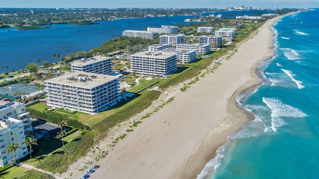 bird's eye view with a water view and a view of the beach