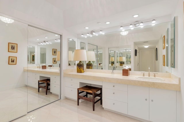 bathroom with tile flooring and vanity