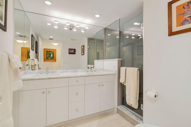 bathroom featuring dual bowl vanity, tile floors, and walk in shower