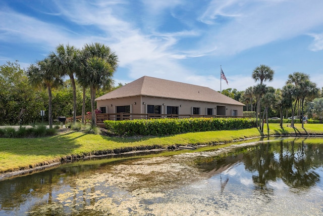 birds eye view of property with a water view and a view of the beach