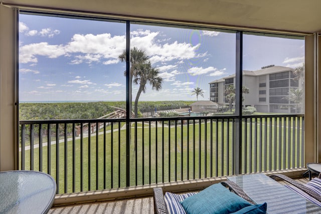 birds eye view of property featuring a water view and a view of the beach