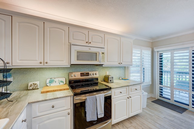 birds eye view of property featuring a view of the beach and a water view