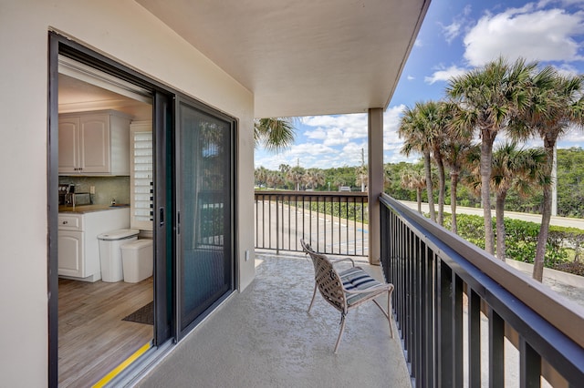 view of swimming pool featuring a water view and a patio