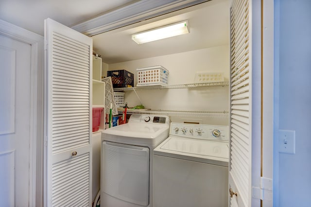 laundry area featuring washing machine and clothes dryer