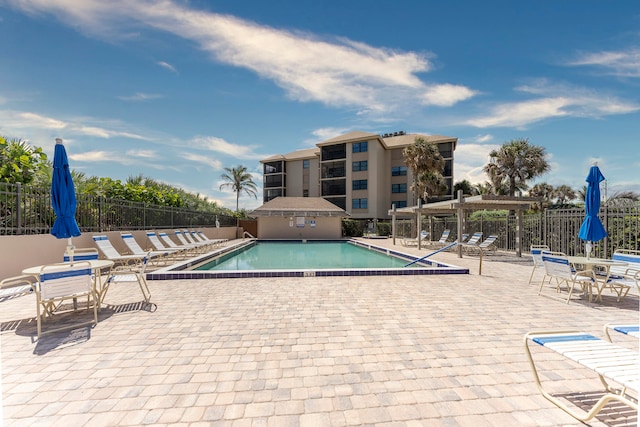 view of swimming pool with a patio area