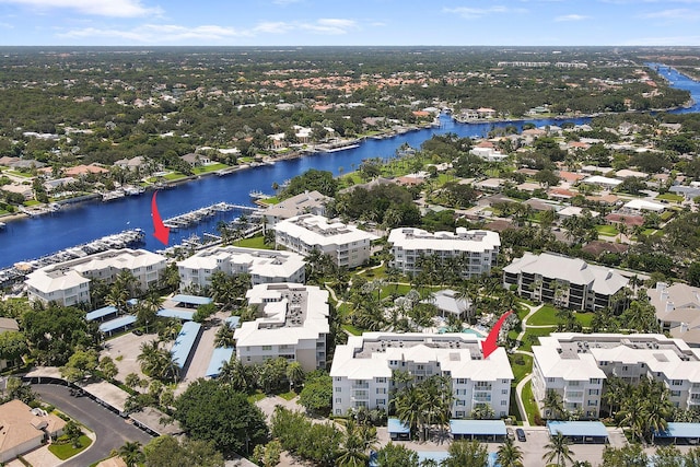 birds eye view of property with a water view