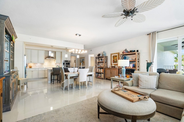 tiled living room featuring ceiling fan