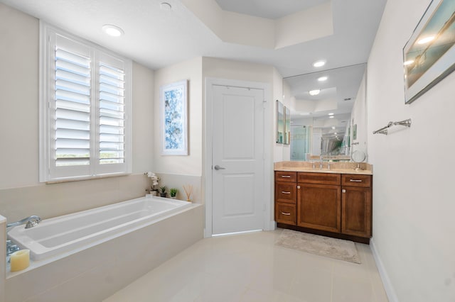 bathroom with independent shower and bath, vanity, and tile patterned floors