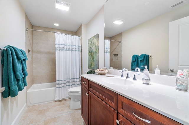 full bathroom featuring vanity, shower / bath combo, tile patterned floors, and toilet