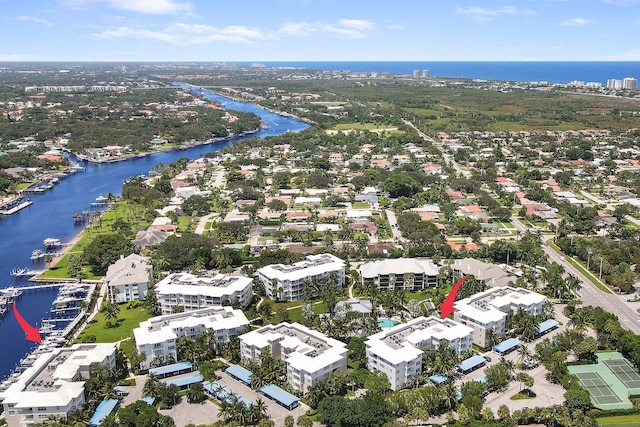 birds eye view of property with a water view