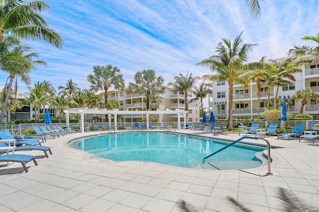 view of swimming pool featuring a pergola and a patio