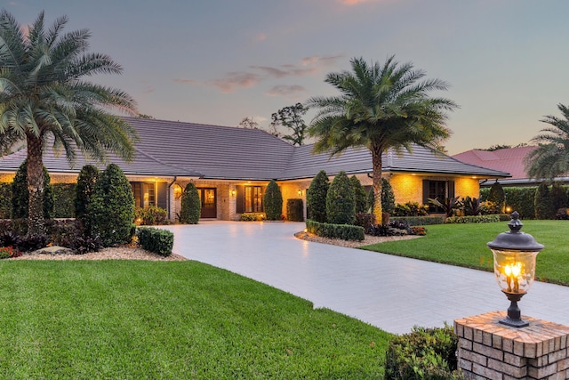 view of front of property with a lawn