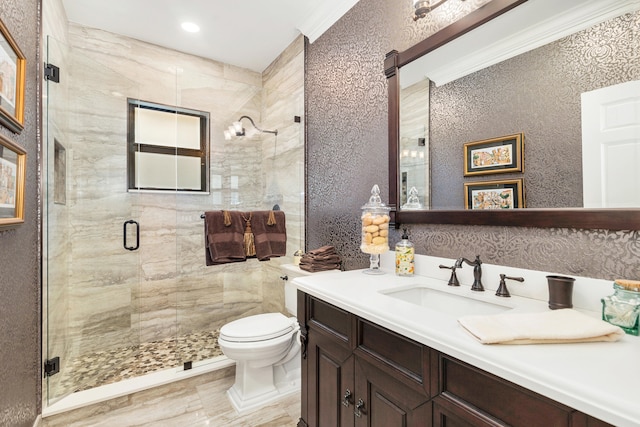 bathroom featuring vanity, ornamental molding, an enclosed shower, and toilet