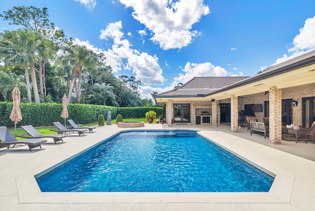 view of swimming pool featuring a patio area