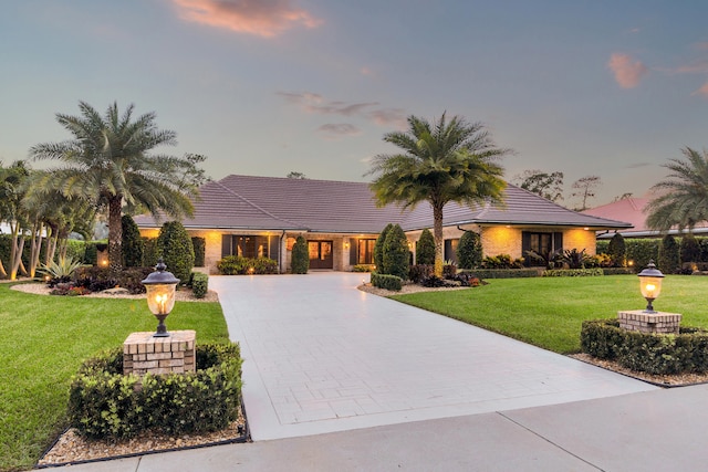 view of front of home with a yard