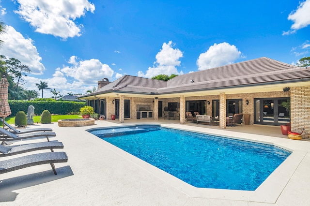 view of pool featuring an outdoor living space and a patio