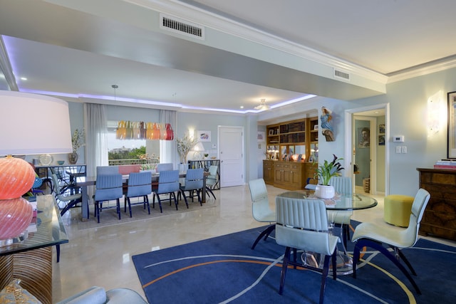 dining room featuring ornamental molding