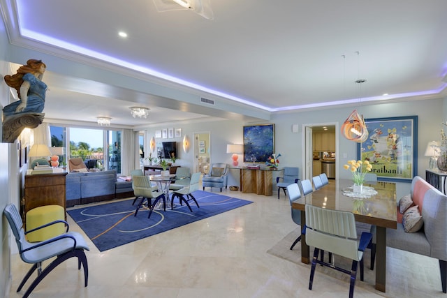 dining room featuring crown molding