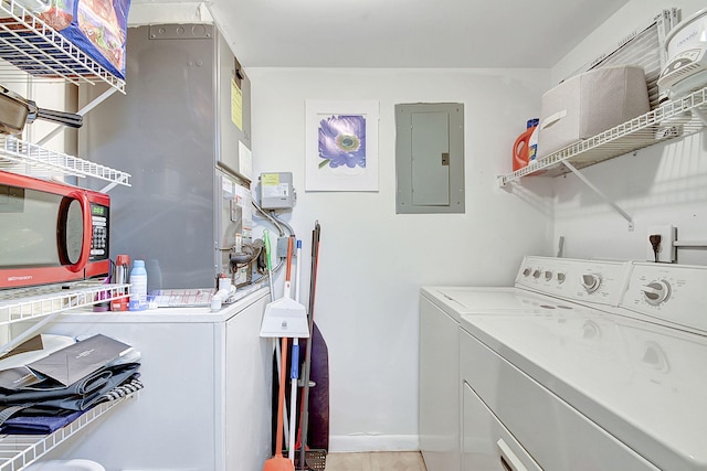 clothes washing area with washing machine and clothes dryer