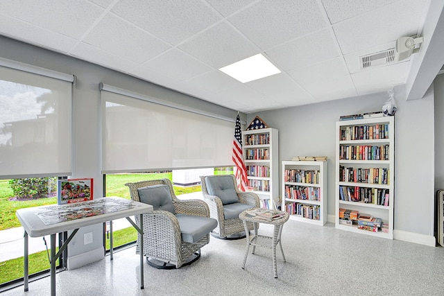 sitting room featuring a paneled ceiling