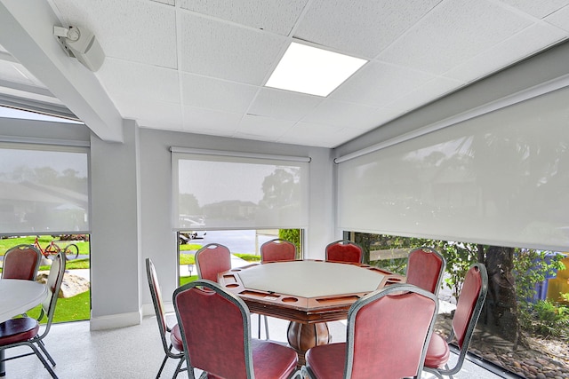 sunroom / solarium with a paneled ceiling and plenty of natural light