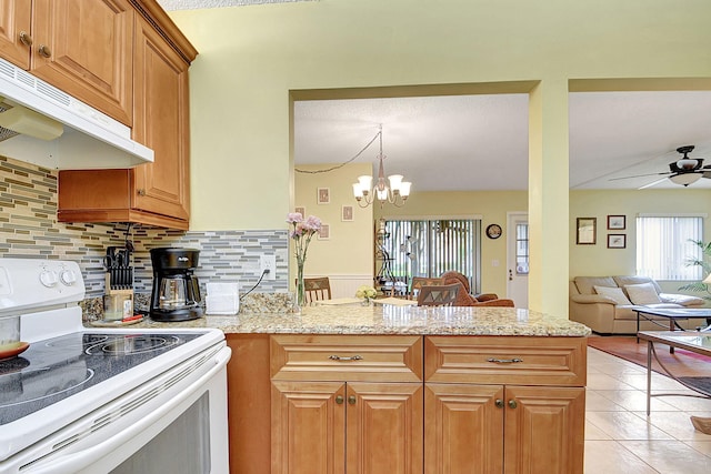 kitchen with light tile flooring, electric stove, ceiling fan with notable chandelier, tasteful backsplash, and light stone counters