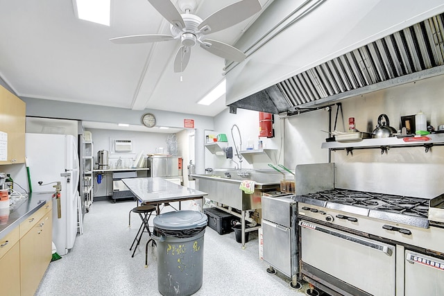 kitchen featuring appliances with stainless steel finishes, ceiling fan, custom exhaust hood, and an AC wall unit