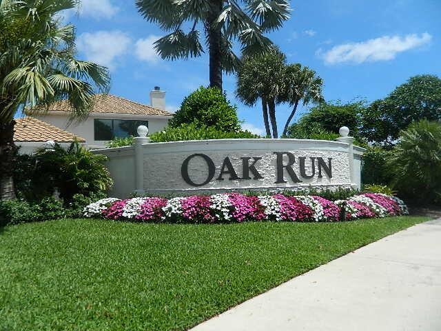 community / neighborhood sign with a lawn