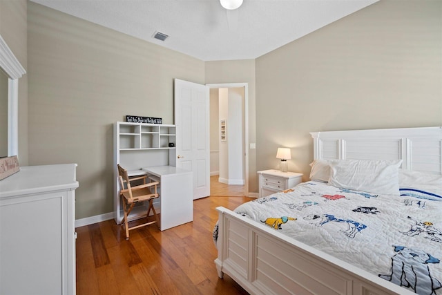 bedroom with ceiling fan and light wood-type flooring