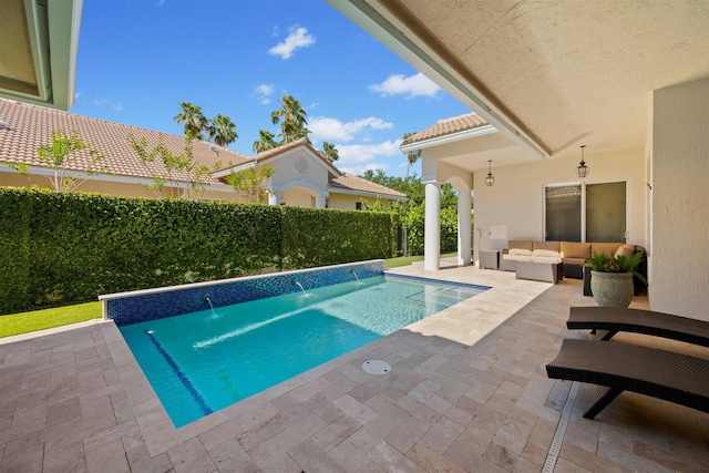 view of swimming pool featuring an outdoor living space, pool water feature, and a patio