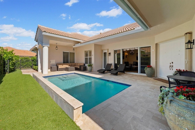 view of swimming pool featuring a patio, an outdoor hangout area, and a yard