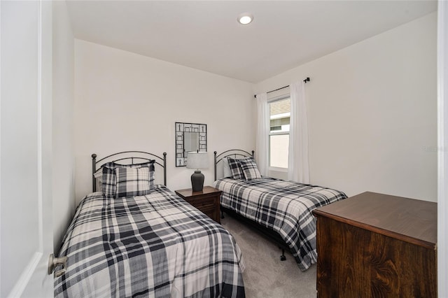 bedroom featuring dark colored carpet