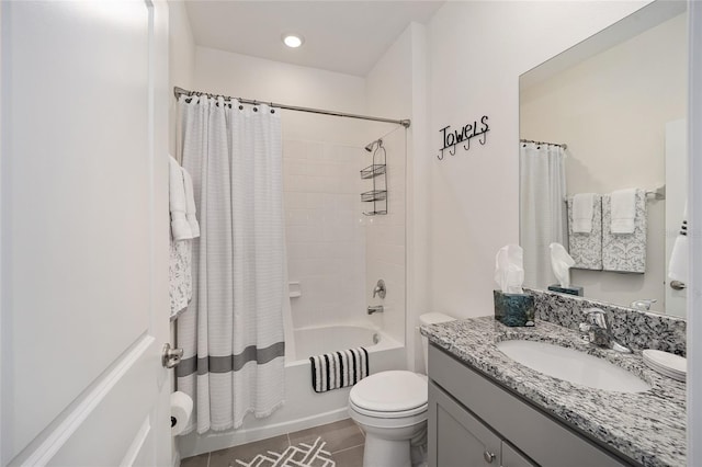 full bathroom with shower / bath combo, toilet, vanity, and tile floors