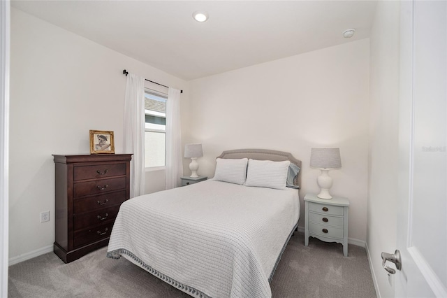 bedroom featuring light colored carpet