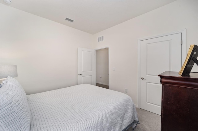 bedroom featuring light colored carpet