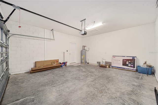 garage featuring gas water heater and a garage door opener